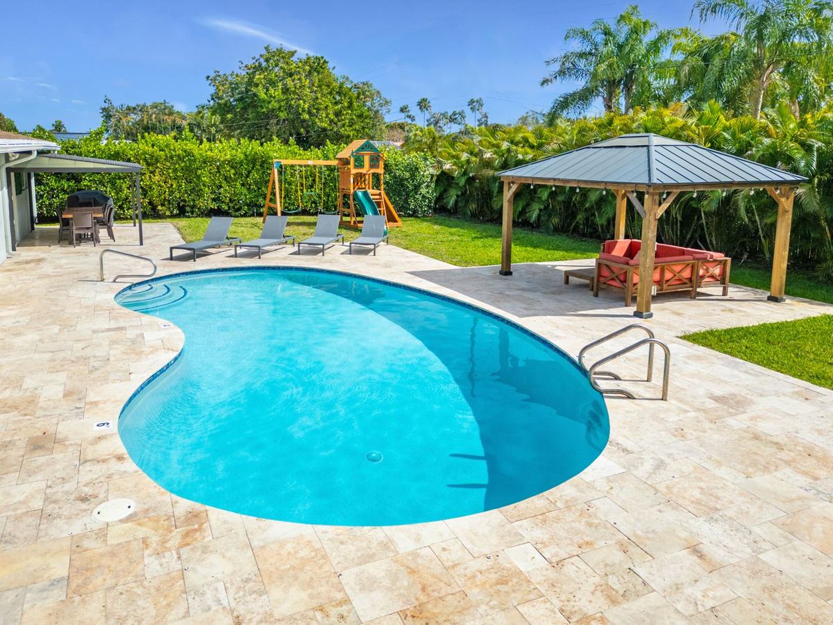 StayRnR-renovated backyard with pool, gazebo, and outdoor entertaining area